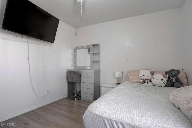 bedroom with light wood-style floors