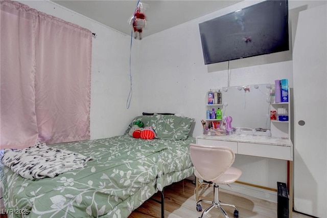 bedroom with wood finished floors