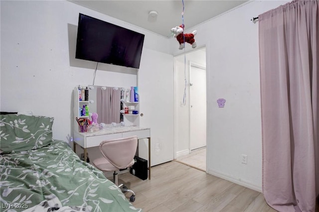 bedroom with light wood-type flooring