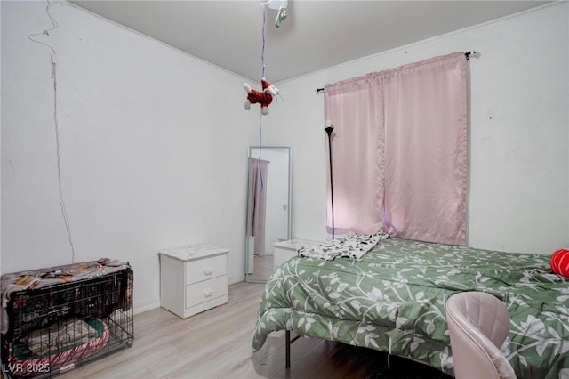 bedroom with light wood-type flooring