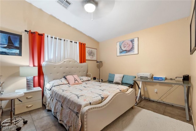 bedroom with a ceiling fan, lofted ceiling, visible vents, and tile patterned floors