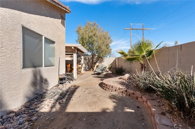 view of yard with a patio and a fenced backyard