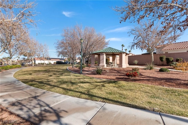 view of yard with fence and a gazebo