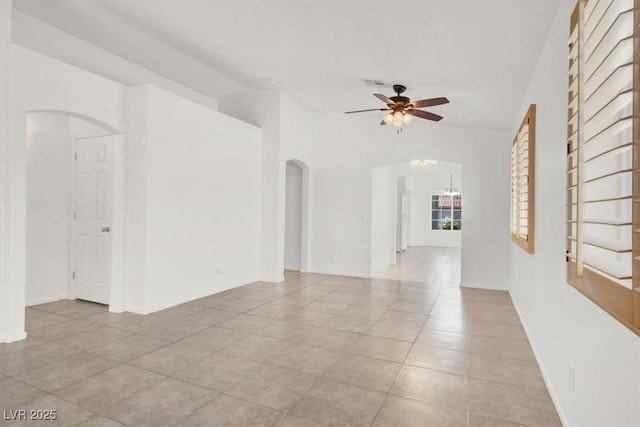 2137 Hidden Ranch Ter, Henderson, NV 89052 - spare room featuring arched walkways, ceiling fan, and light tile patterned floors