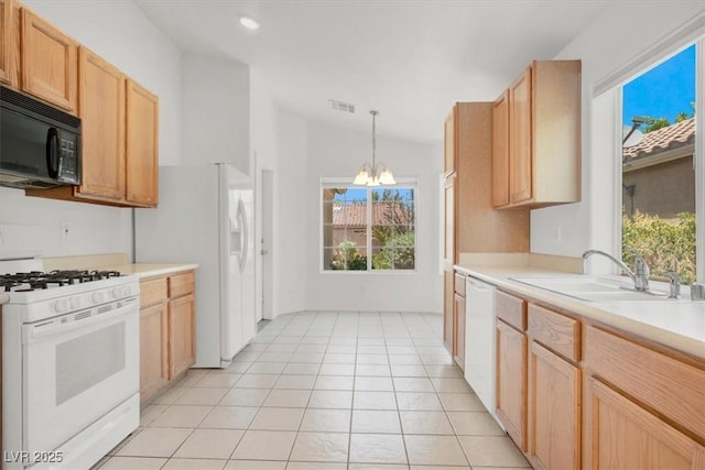 2137 Hidden Ranch Ter, Henderson, NV 89052 - kitchen featuring white appliances, a chandelier, light countertops, light brown cabinets, and pendant lighting
