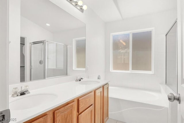 2137 Hidden Ranch Ter, Henderson, NV 89052 - bathroom featuring a garden tub, double vanity, and an enclosed shower
