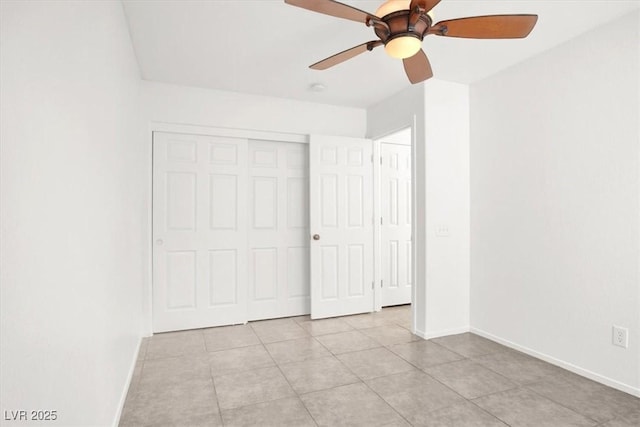 2137 Hidden Ranch Ter, Henderson, NV 89052 - unfurnished bedroom featuring light tile patterned floors, a closet, and a ceiling fan