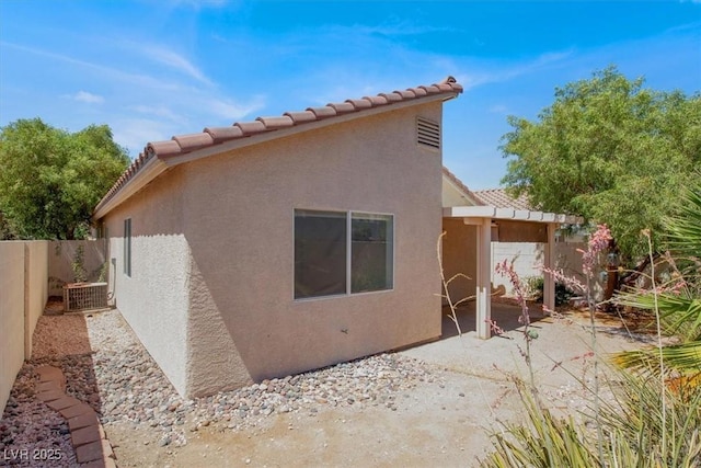 2137 Hidden Ranch Ter, Henderson, NV 89052 - back of property with a patio, stucco siding, a fenced backyard, and a tiled roof