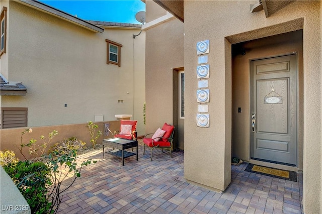 property entrance featuring stucco siding