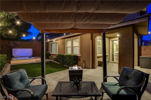 view of patio / terrace featuring an outdoor fire pit, fence, and a pergola