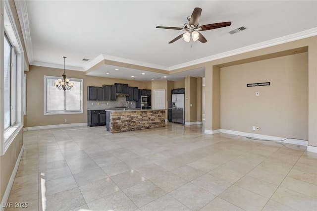 unfurnished living room featuring baseboards, visible vents, ornamental molding, and ceiling fan with notable chandelier
