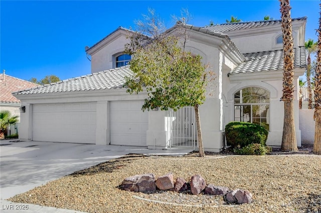 view of front facade featuring a garage, concrete driveway, a tiled roof, and stucco siding