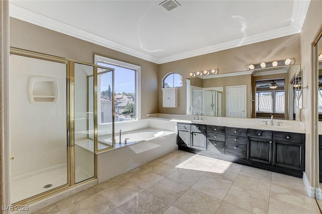 bathroom featuring double vanity, a garden tub, and a shower stall