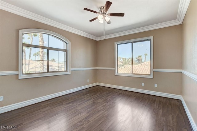 spare room featuring a healthy amount of sunlight, ceiling fan, baseboards, and dark wood finished floors
