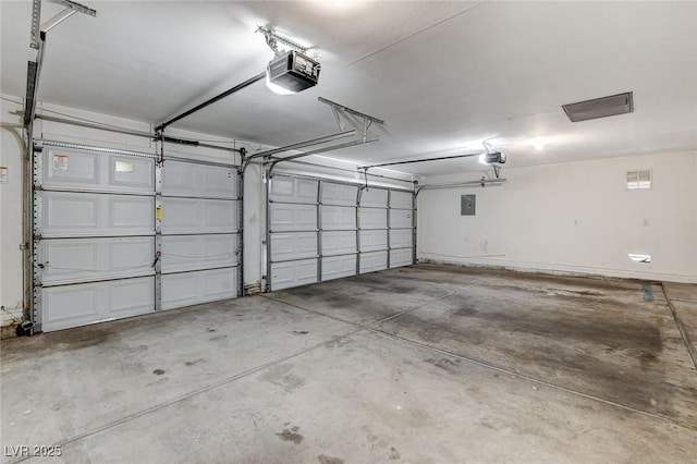 garage with electric panel and a garage door opener