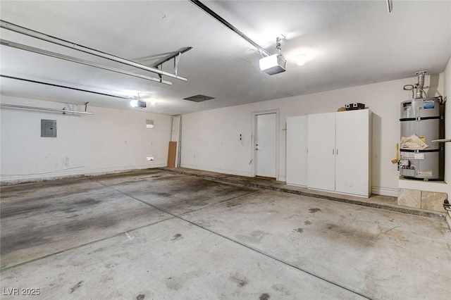 garage featuring a garage door opener, strapped water heater, and electric panel