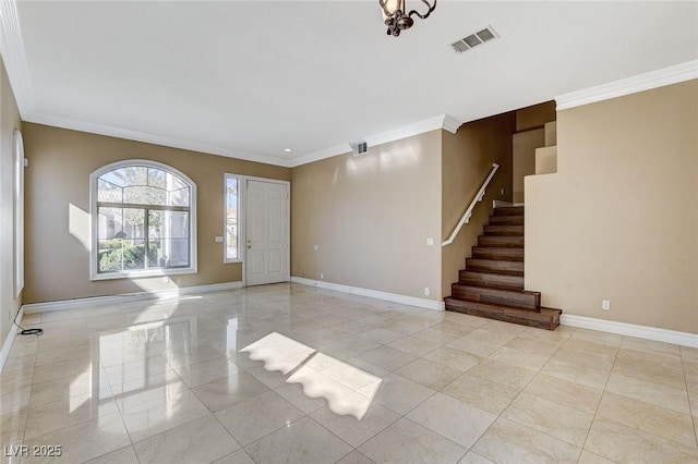 foyer entrance with visible vents, baseboards, and stairs