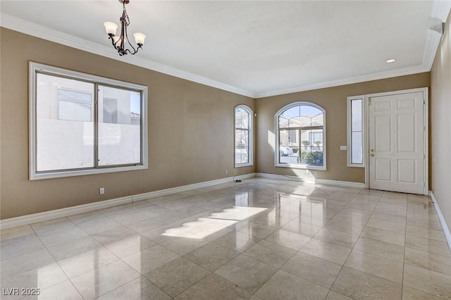 entrance foyer featuring a notable chandelier, crown molding, and baseboards