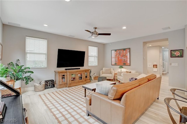 living room with light wood finished floors, recessed lighting, visible vents, a ceiling fan, and baseboards