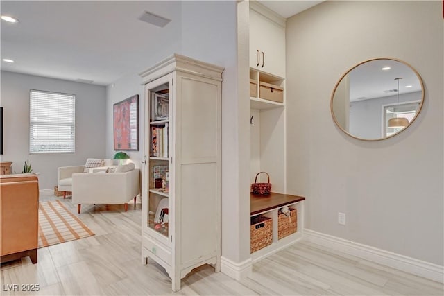 mudroom featuring recessed lighting, visible vents, and baseboards