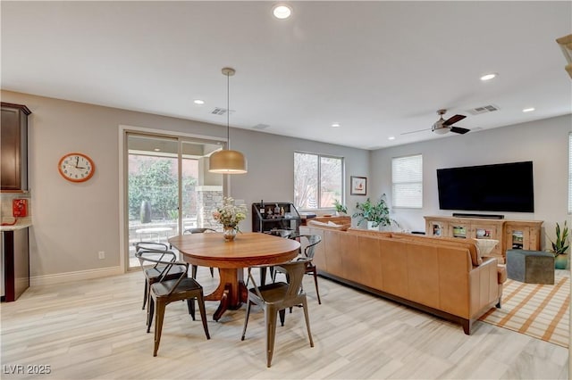 dining area featuring light wood-style flooring, visible vents, baseboards, and recessed lighting