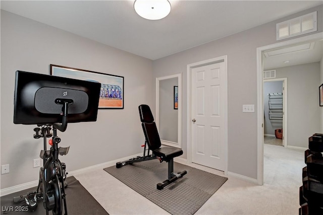 exercise area with carpet, visible vents, and baseboards