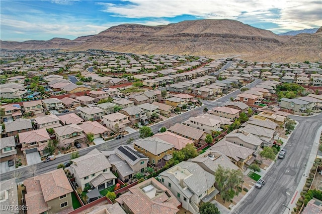 drone / aerial view featuring a residential view and a mountain view