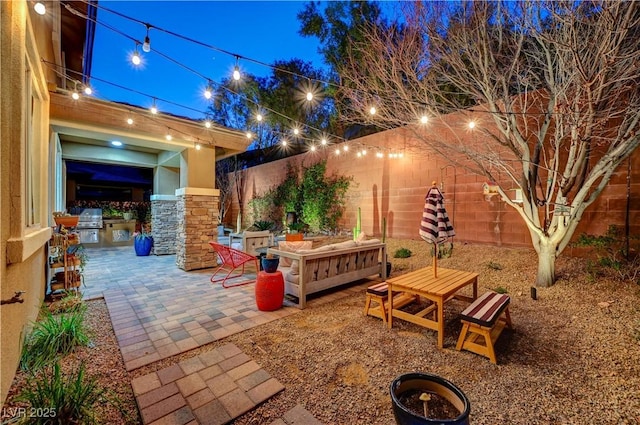 view of patio with outdoor dining space, area for grilling, and a fenced backyard