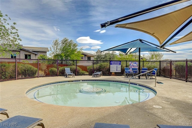 pool featuring a patio area and fence