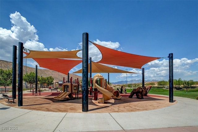 community jungle gym with a mountain view