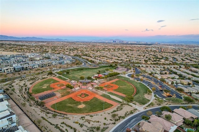 aerial view at dusk with a residential view and a mountain view