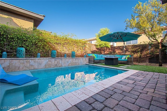 view of pool with a patio area, a fenced backyard, outdoor lounge area, and a fenced in pool