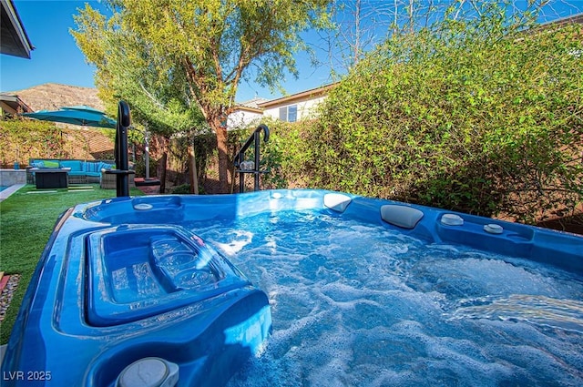 view of pool featuring an outdoor living space and a hot tub