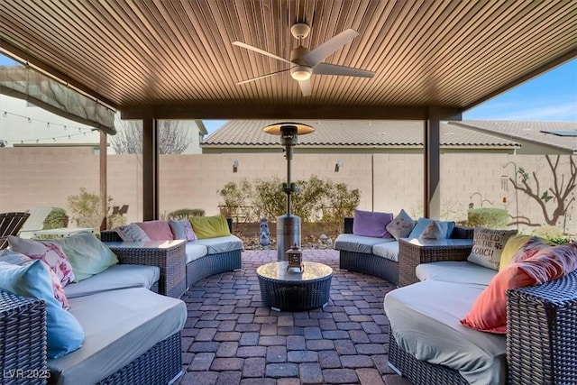 view of patio / terrace featuring a fenced backyard, an outdoor hangout area, and ceiling fan