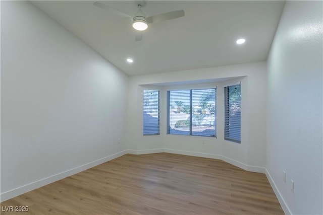 spare room with light wood finished floors, ceiling fan, baseboards, and recessed lighting