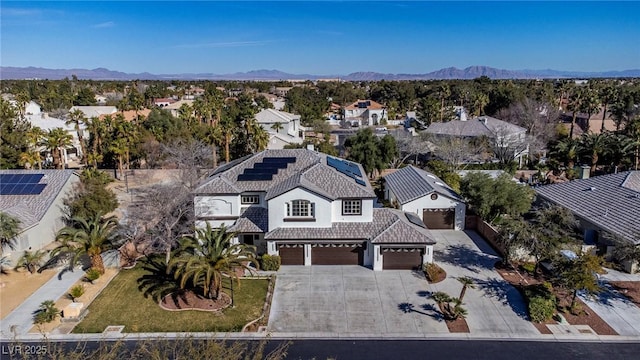 birds eye view of property featuring a mountain view