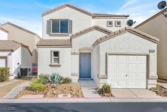 view of front of home with a tile roof, driveway, an attached garage, and stucco siding