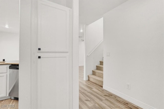 interior space with baseboards and wood finished floors