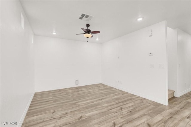 empty room with light wood-type flooring, visible vents, and recessed lighting