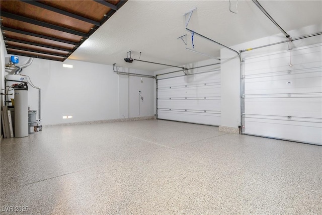 garage with a garage door opener and baseboards