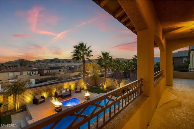 balcony with a patio and a mountain view