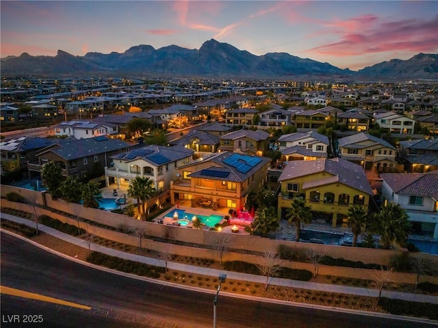 aerial view at dusk with a residential view and a mountain view