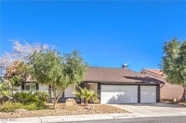 single story home with a garage, driveway, and stucco siding