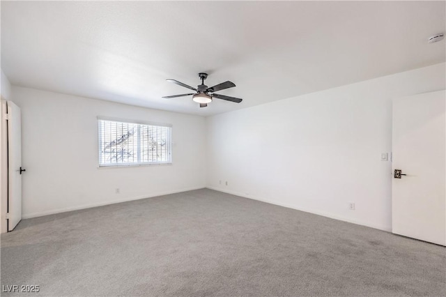 unfurnished room featuring ceiling fan and carpet floors