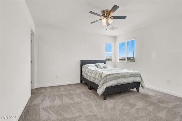 bedroom featuring light colored carpet, visible vents, and baseboards