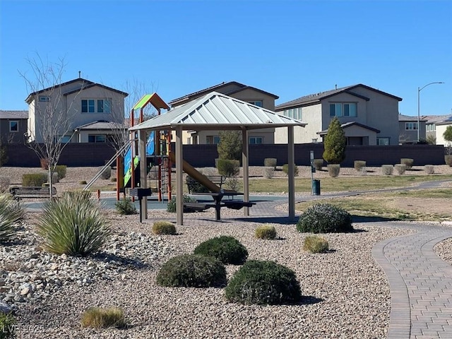 communal playground featuring a residential view