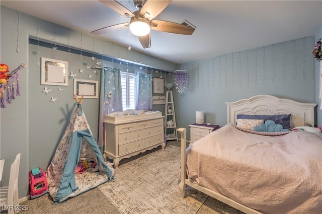 carpeted bedroom with ceiling fan