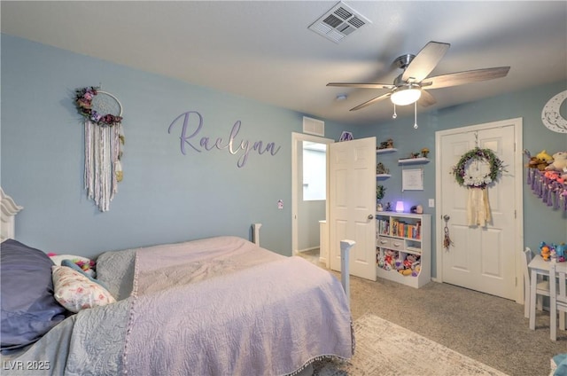 bedroom with ceiling fan, visible vents, and light colored carpet