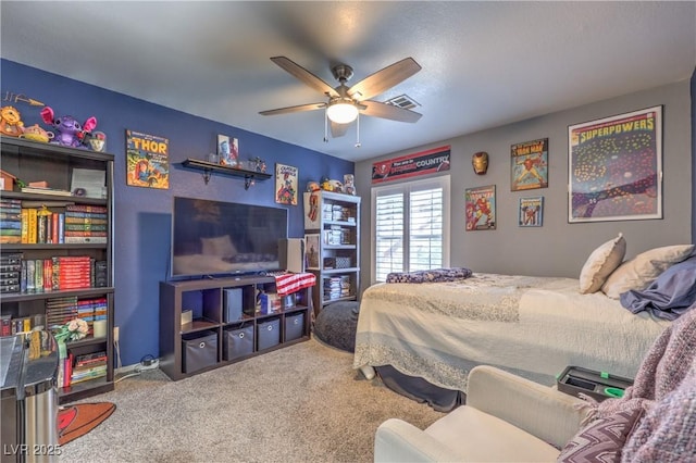 bedroom featuring carpet flooring, ceiling fan, and visible vents