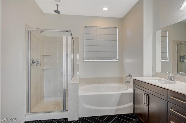 full bath with a garden tub, a stall shower, and vanity